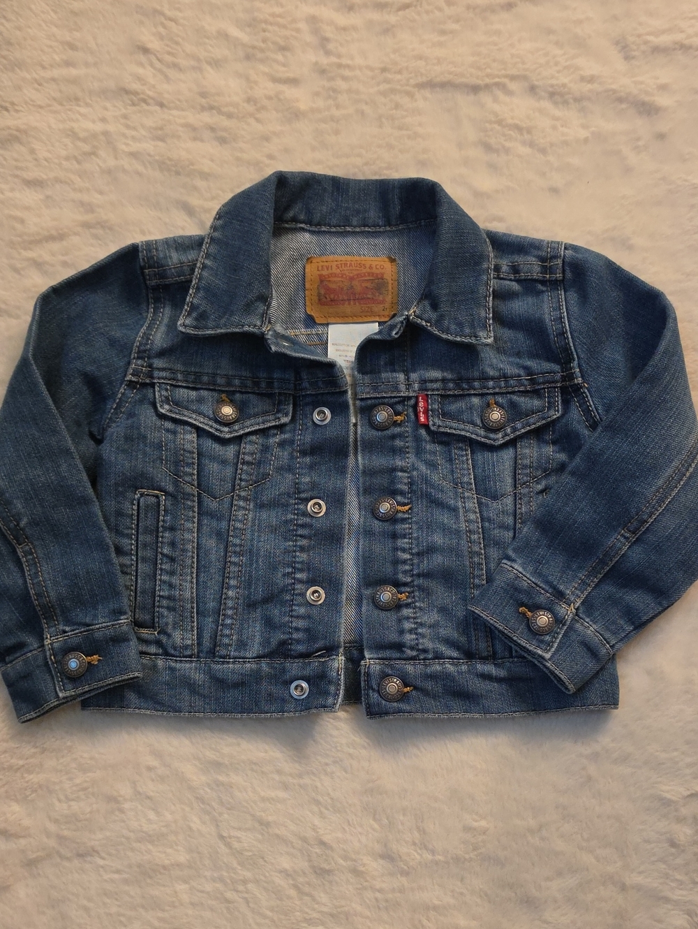 Levi's 2 T Toddler Denim Trucker Jacket in a medium blue wash.